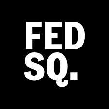 Black square with bold white text in the center reading "FED SQ.